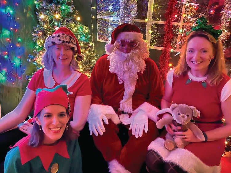 Santa and his elves take a well-earned breather.