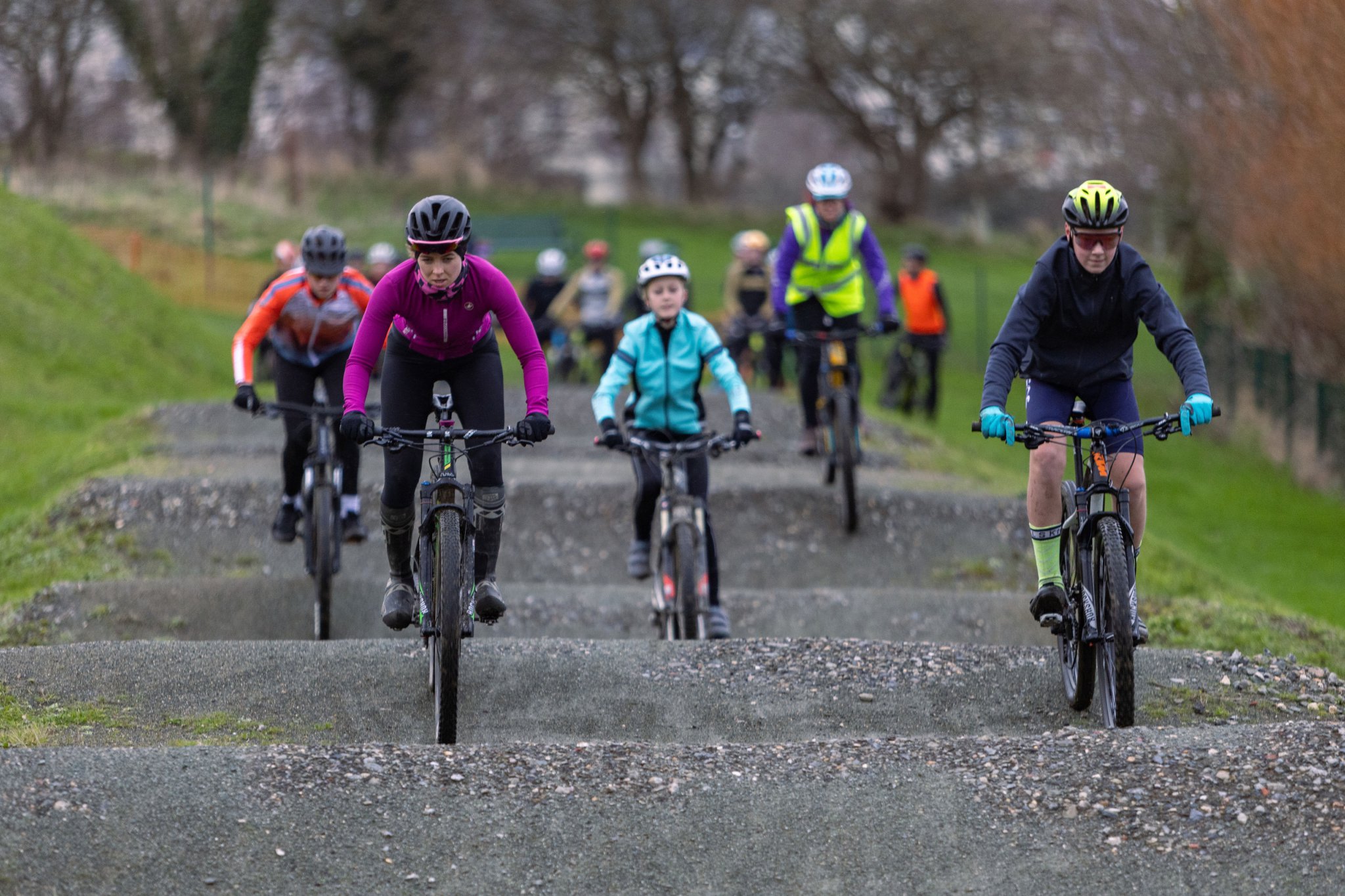 Kirree Quayle (left) makes a strong start in the front group over the BMX yumps. She and Florence Griffin were the leading female pair in 11th place. Also pictured (centre) is Abi Clayton