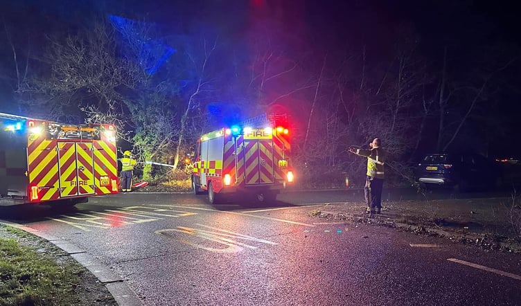 TWO people had to be cut free from their car by firefighters after it crashed down a sharp bank and ended up in a wooded area in Teigngrace. Picture: Bovey Tracey Fire Station (Dec 23 2022)