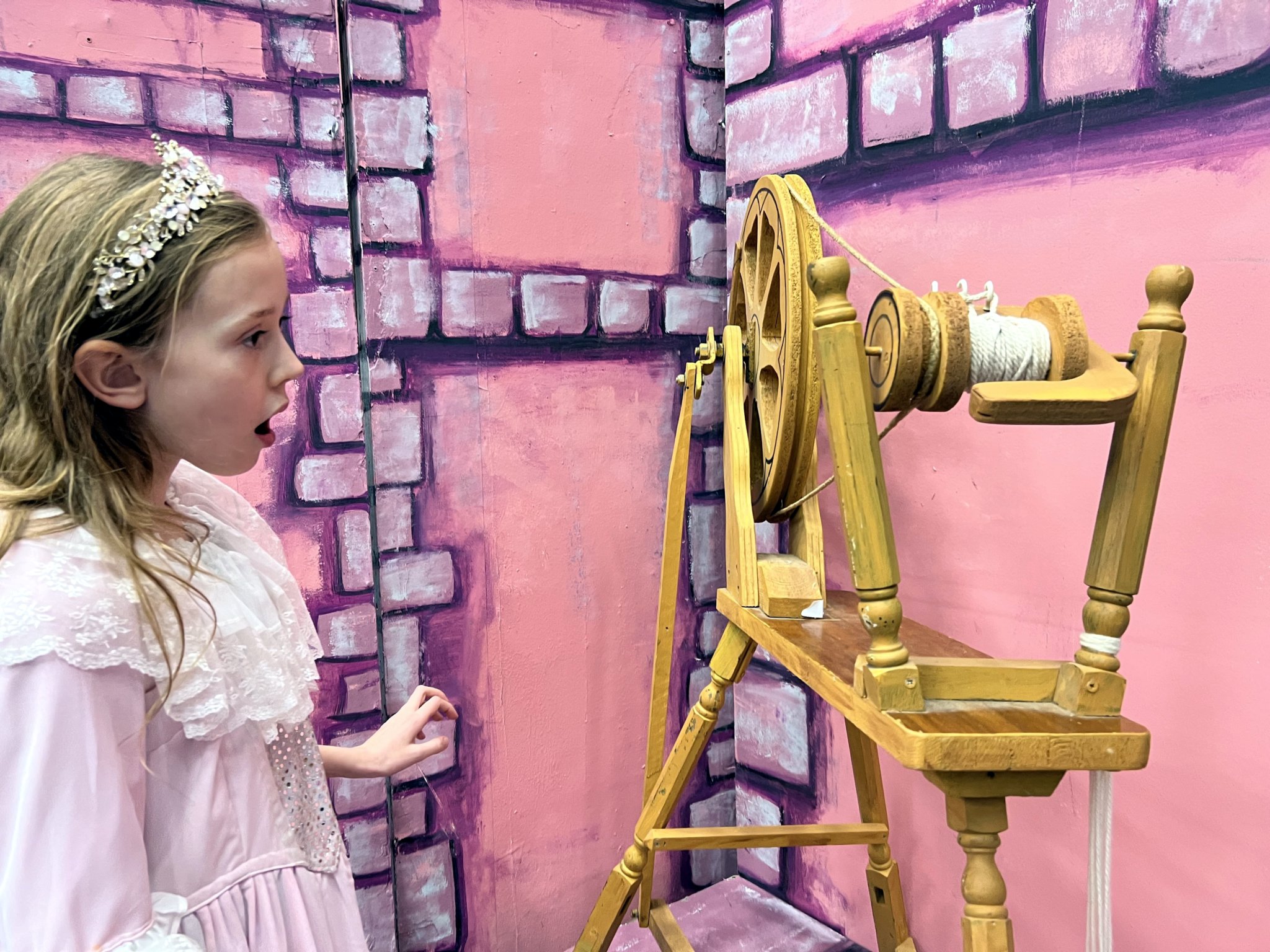 Young Aurora – Becca Smith – spies the spinning wheeel.
Sleeping Beauty will be performed live by the the Teignmouth Players at the Pavilions Teignmouth from December 28 until January 1.
Pictures supplied by Roger Smith