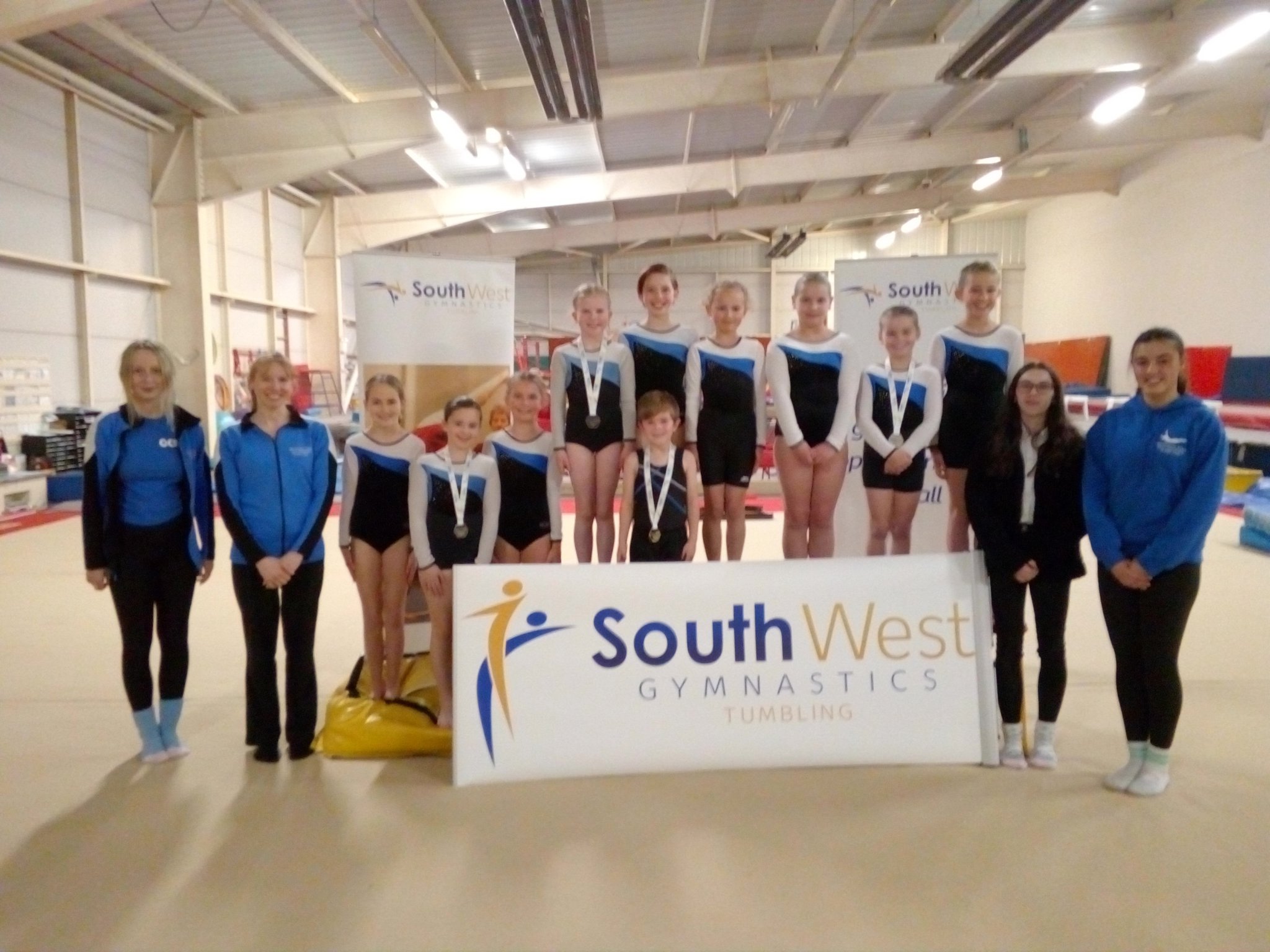 MAIN: Front row - Bethany Hill (coach), Vicki Pritchard (head coach), Gracie Cann, Meagan Fletcher, Rosie Cann, Jasper Pudner, Teegan Smith (coach and judge), Miya Porter (coach); Back row - Lily Putman, Freya Hancock, Emily Szwarc, Bethany Medland, Evie Nicks, Coral Vallance. RIGHT: Lily Putman (left), Jasper Pudner, Meagan Fletcher, Evie Nicks.