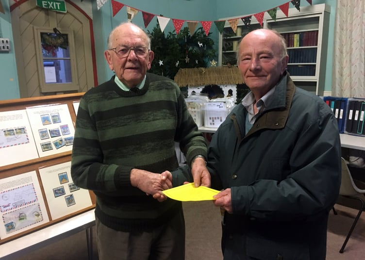 Viv Sandercock was presented with the Launceston Stamp Club’s certificate of appreciation by long standing club member Mike Tooley