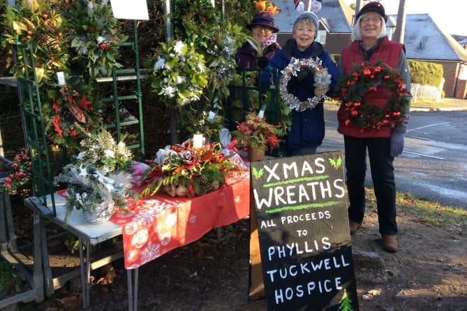 Maggy Thomas (left), Ros Langley and Linda Bone (right) were busy working in Linda’s garage in Rowledge making festive wreaths and decorations