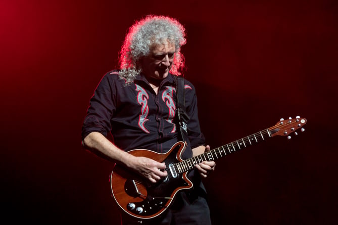 Brian May performing with Queen at The O2