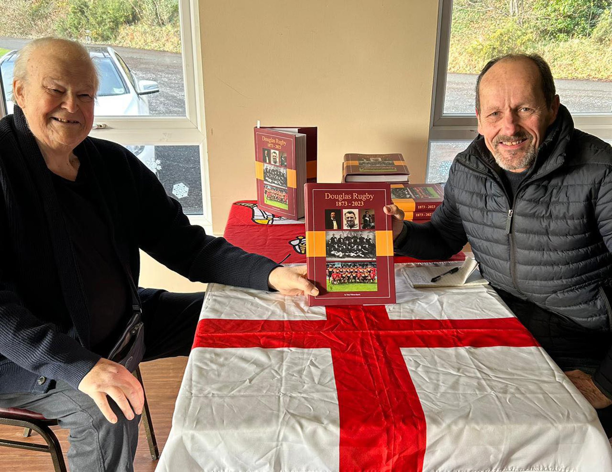 Douglas Rugby Club captain in 1969-70, Brian Leahy (left) beat the queue at Port-e-Chee clubhouse for the first copy of the book to celebrate 150 years of Douglas rugby club on Christmas Eve, pictured with author Tony Wilson-Spratt. The limited edition is on the way to selling out at the pre-match lunch this Saturday when Douglas host Wilmslow in Regional Two North West