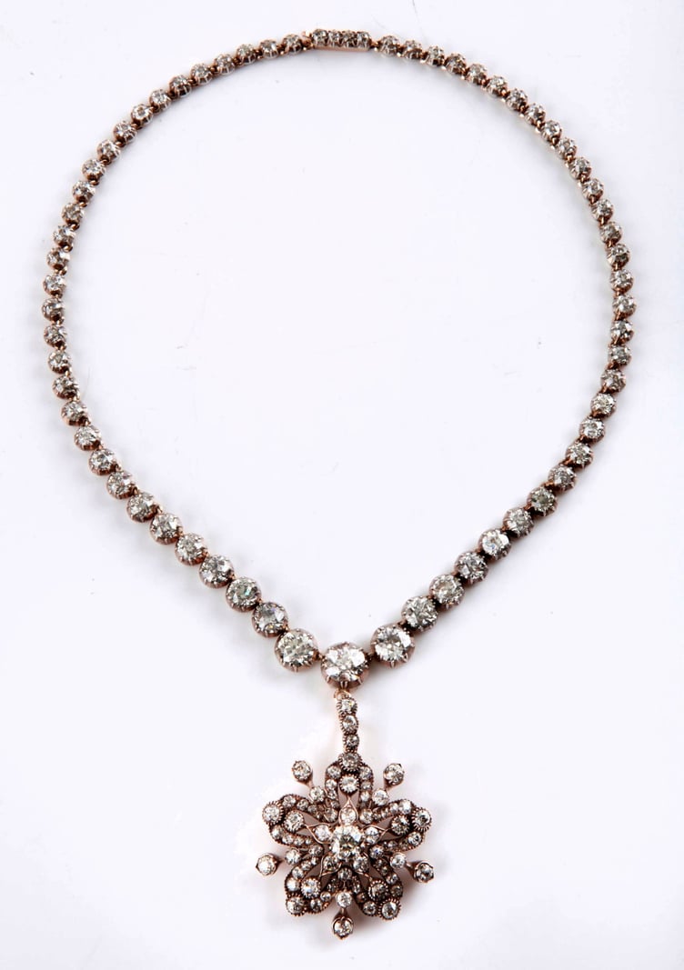 A Victorian diamond Riviere necklace and diamond star pendant/brooch and sold for a total of £37,700.
