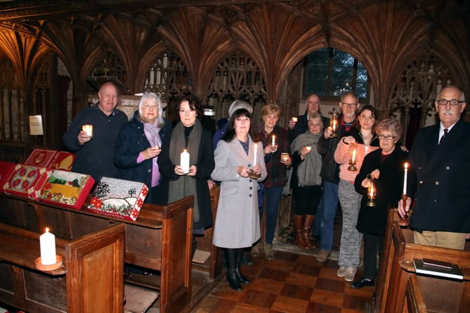 A candlelit service, including prayers for peace in Ukraine was held at Coldridge Parish Church. Pictured are some of those who attended. AQ 5354