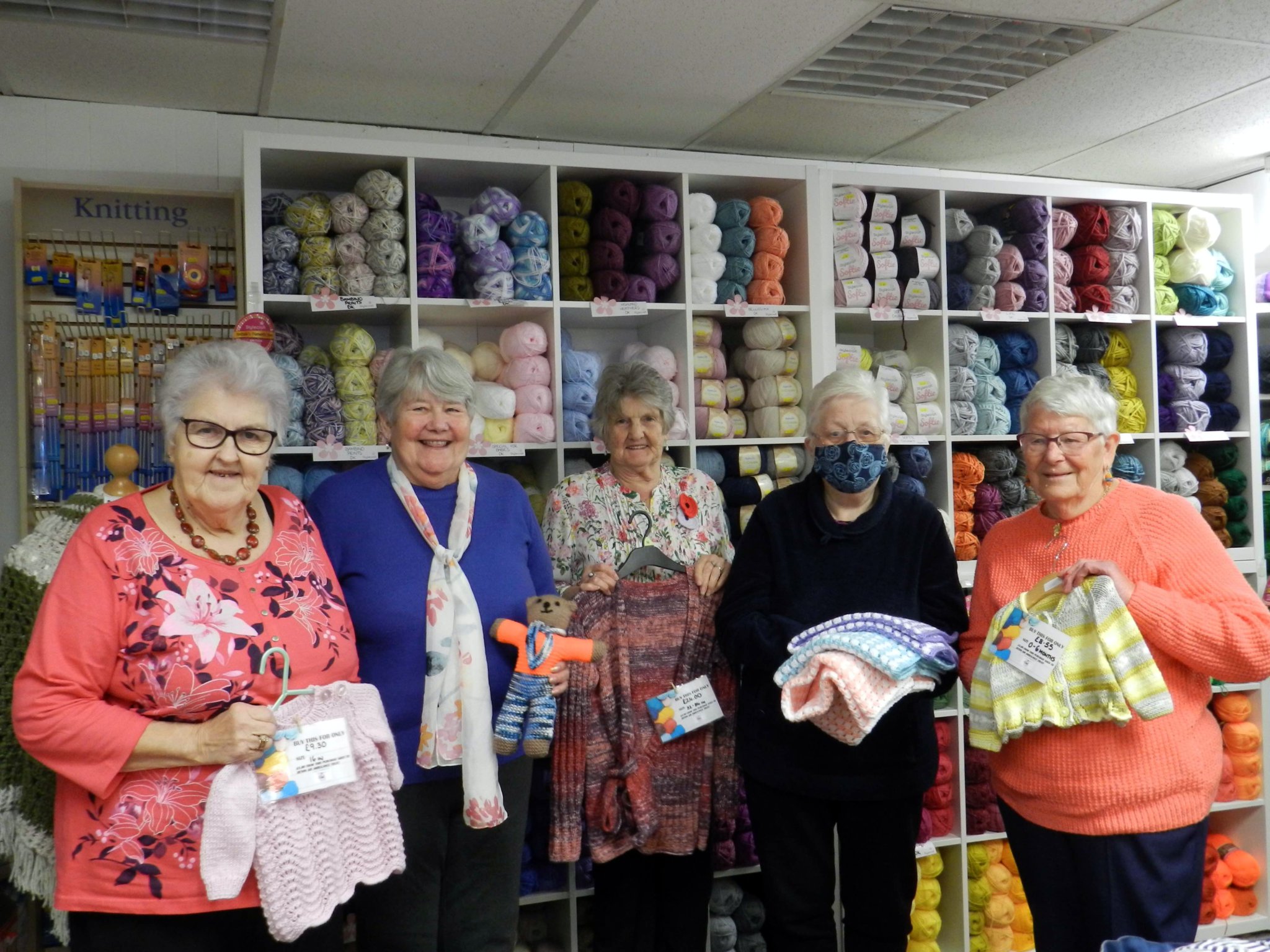 Ladies from Hot Pins Knit and Natter group with some of the items they knitted for the people of Ukraine. NP 021121 01
