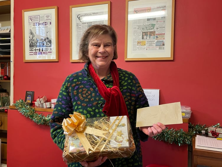 Jane Meincken was second in the Hidden Message competition, pictured receiving her Costa voucher and hamper prize. Unable to attend was her sister Pauline Arnold. AQ 0938