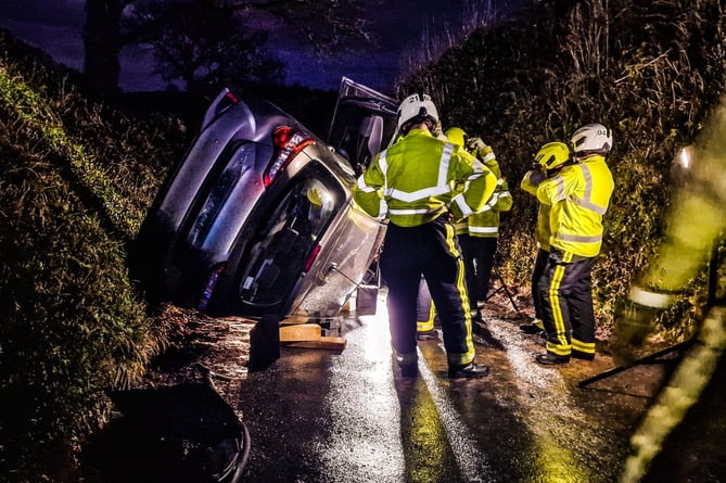 Buckfastleigh firefighters help man escape as car ends up on its side