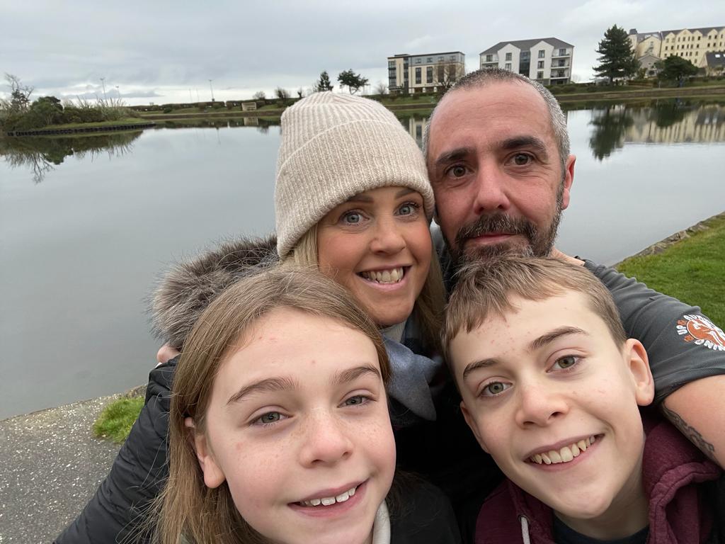 Runner Paul Shanley at Mooragh Park where he finished his 10k a day challenge with wife Carrie and children Sam and Wren
