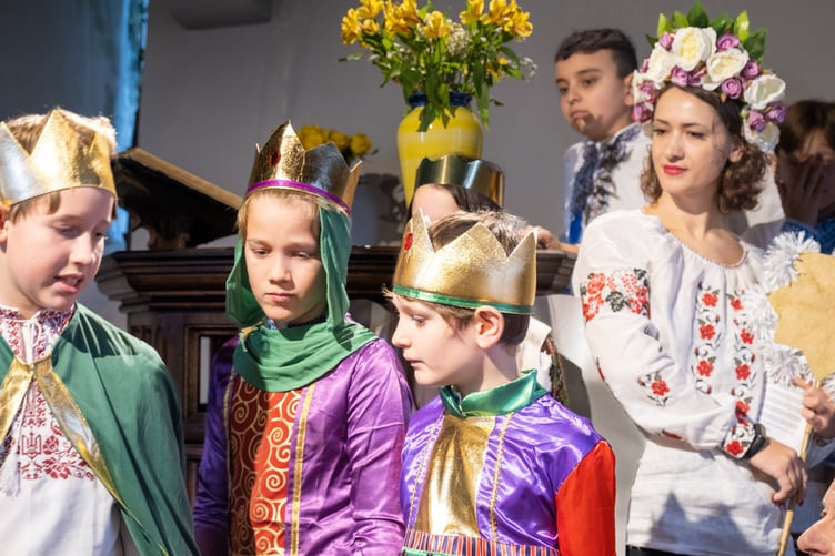 Ukrainian refugees and their local hosts celebrated their traditonal Orthodox Christmas service at the church on Brent Tor (above right). Pictures by Neil Jameson and Nick Shutt