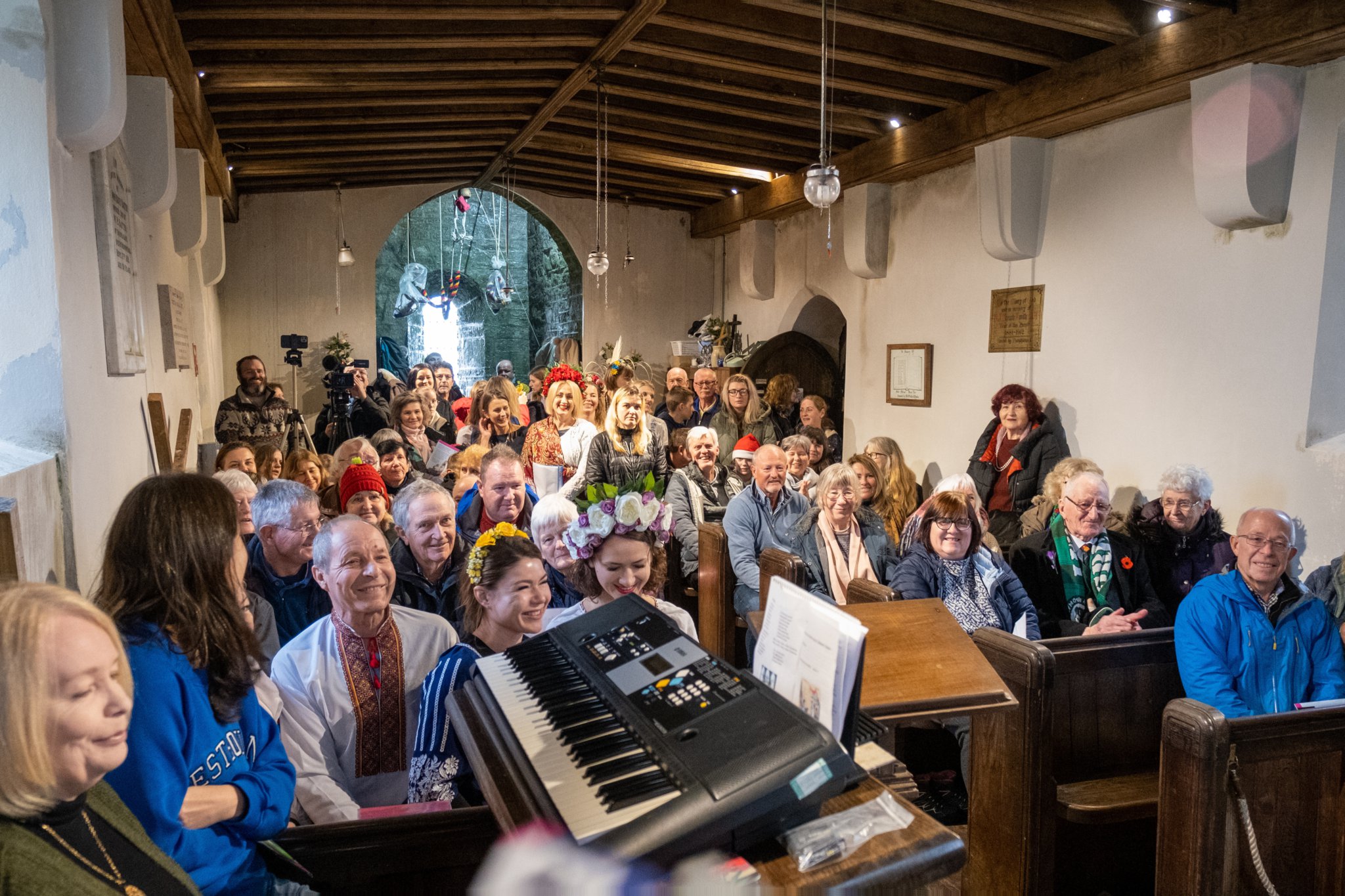 Ukrainian refugees and their local hosts celebrated their traditonal Orthodox Christmas service at the church on Brent Tor (above right). Pictures by Neil Jameson and Nick Shutt