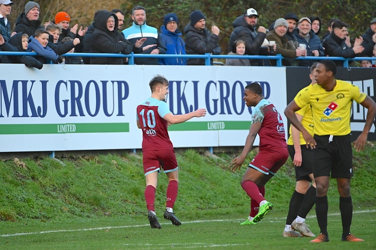 Owen Dean is congratulated by Ange Djadja