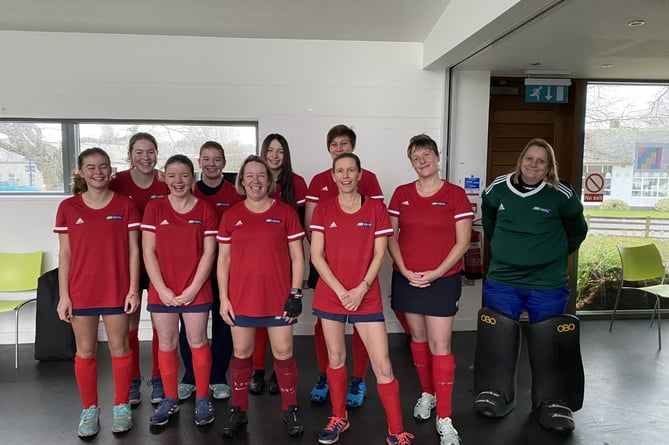Petersfield Hockey Club's women's first team are all smiles after beating Hamble