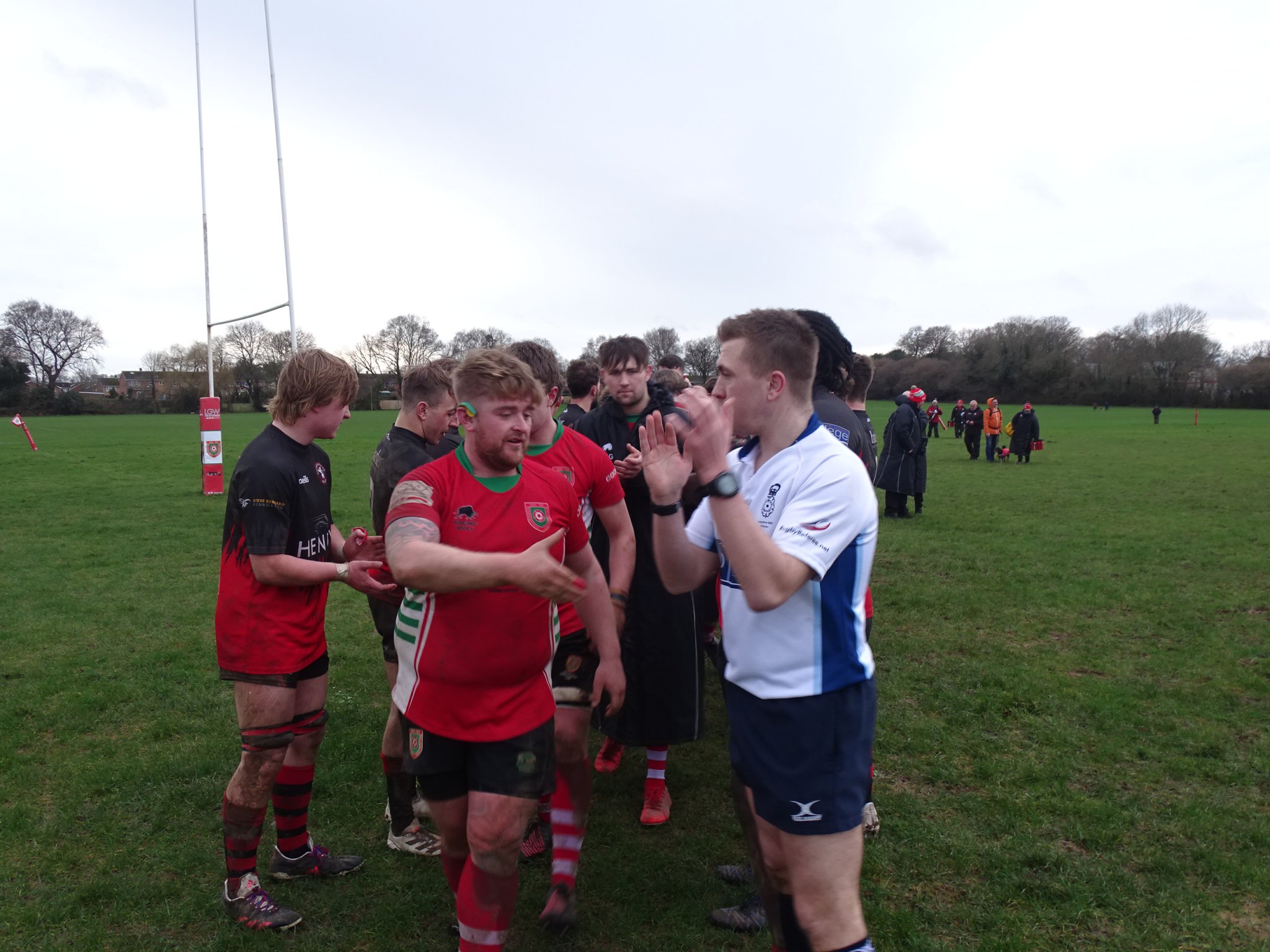 Try scorer and captain Harley Orr leads Petersfield off the pitch