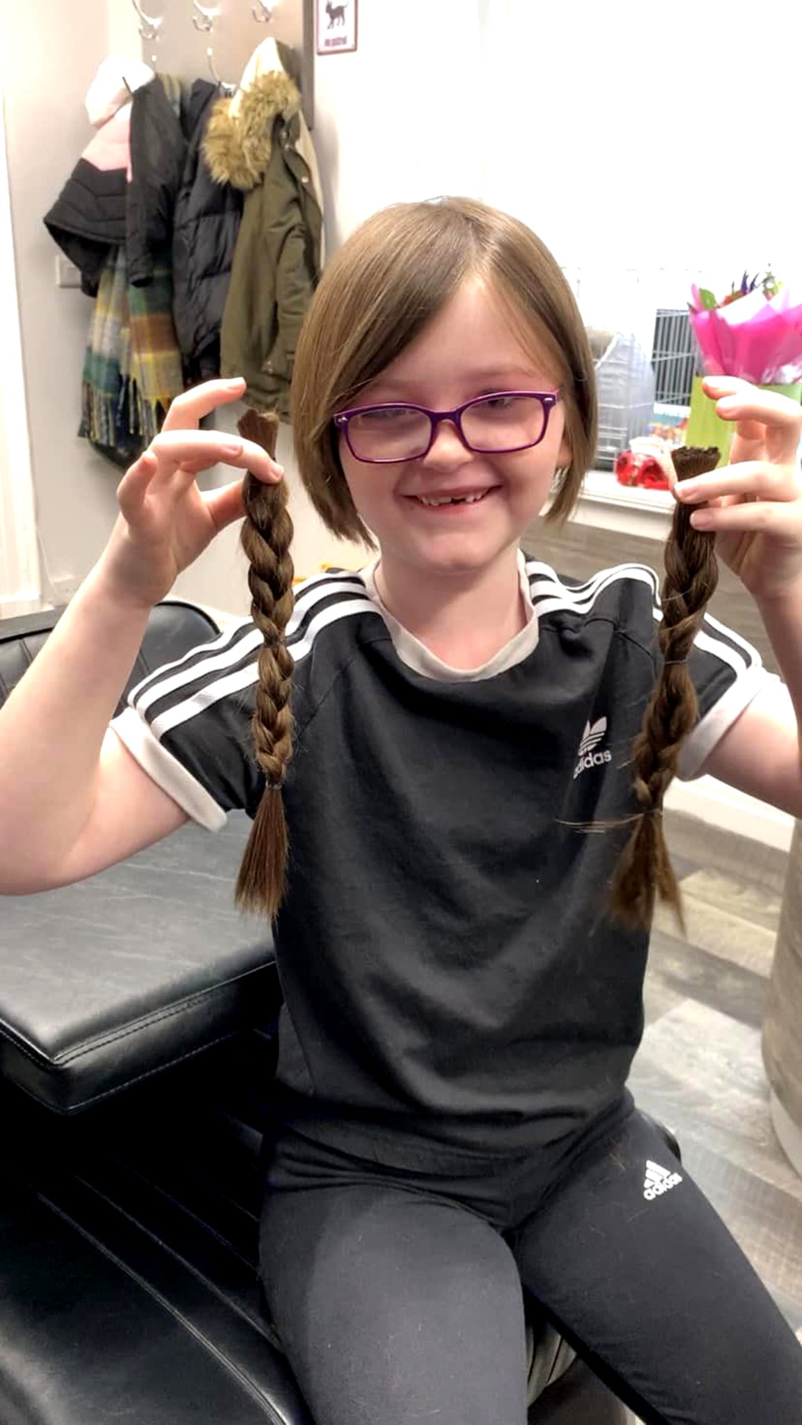 Ava Quilliam-Langton with the 11 inches of hair she is donating to the Little Princess Trust