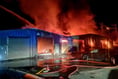 Firefighters battle flames at industrial units