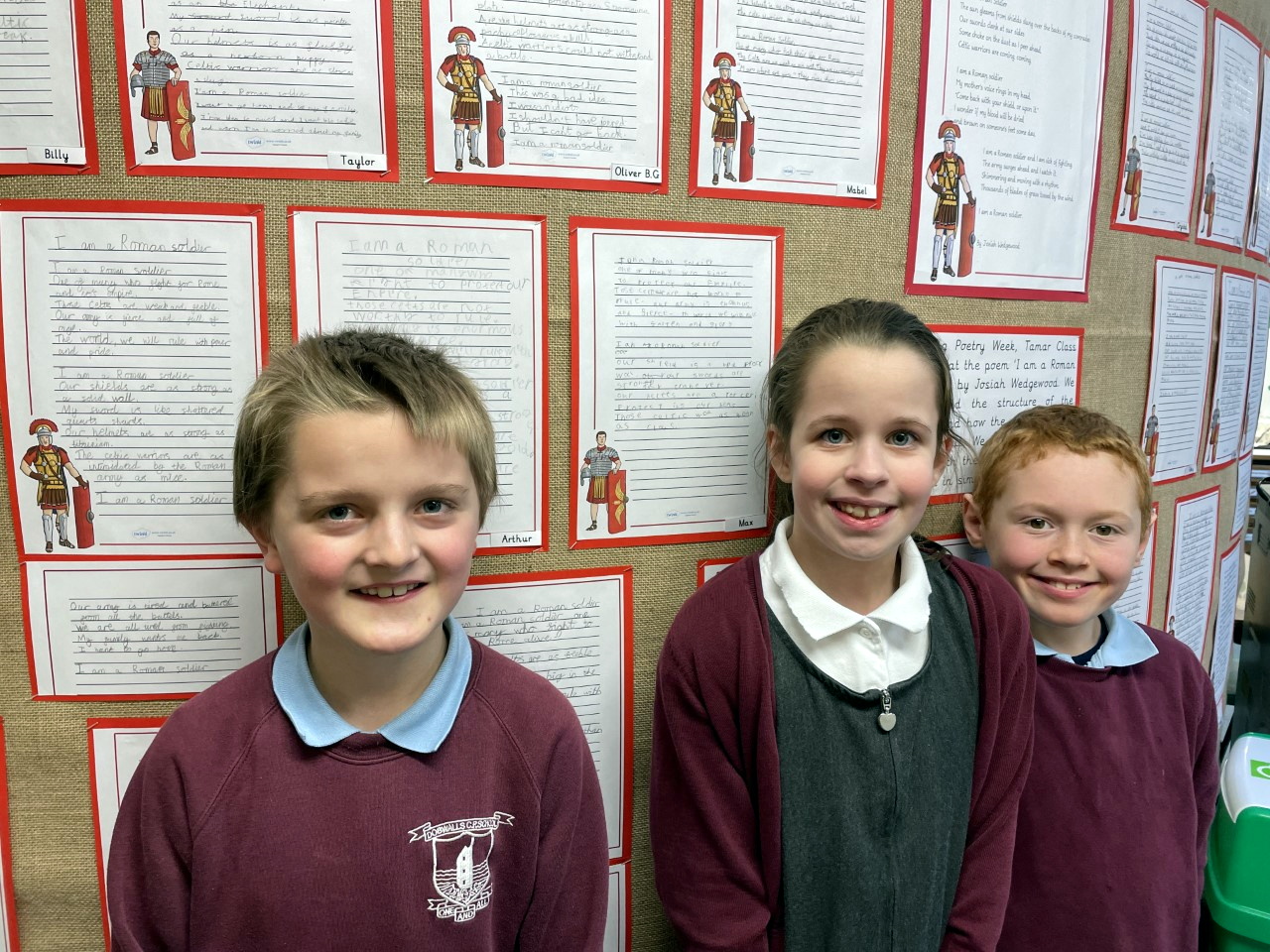 Pupils at Dobwalls Community Primary School with their poetry displays