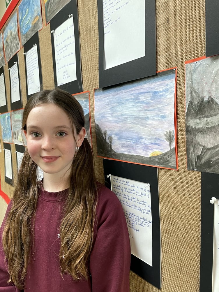 Pupils at Dobwalls Community Primary School with their poetry displays