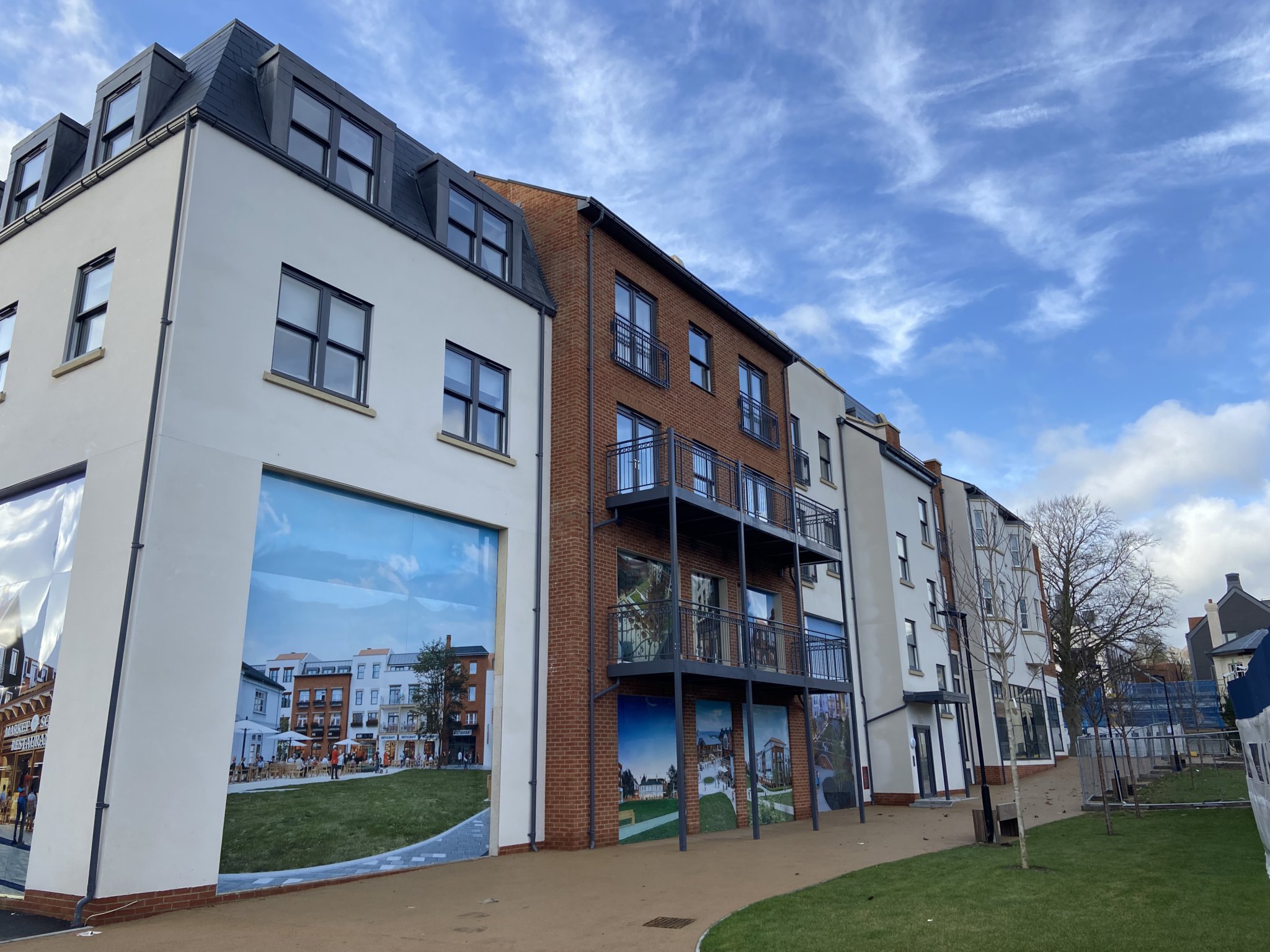 The massive building ‘D20’ backs onto Sainsbury’s car park and features two to three storeys of flats above shops on the ground floor