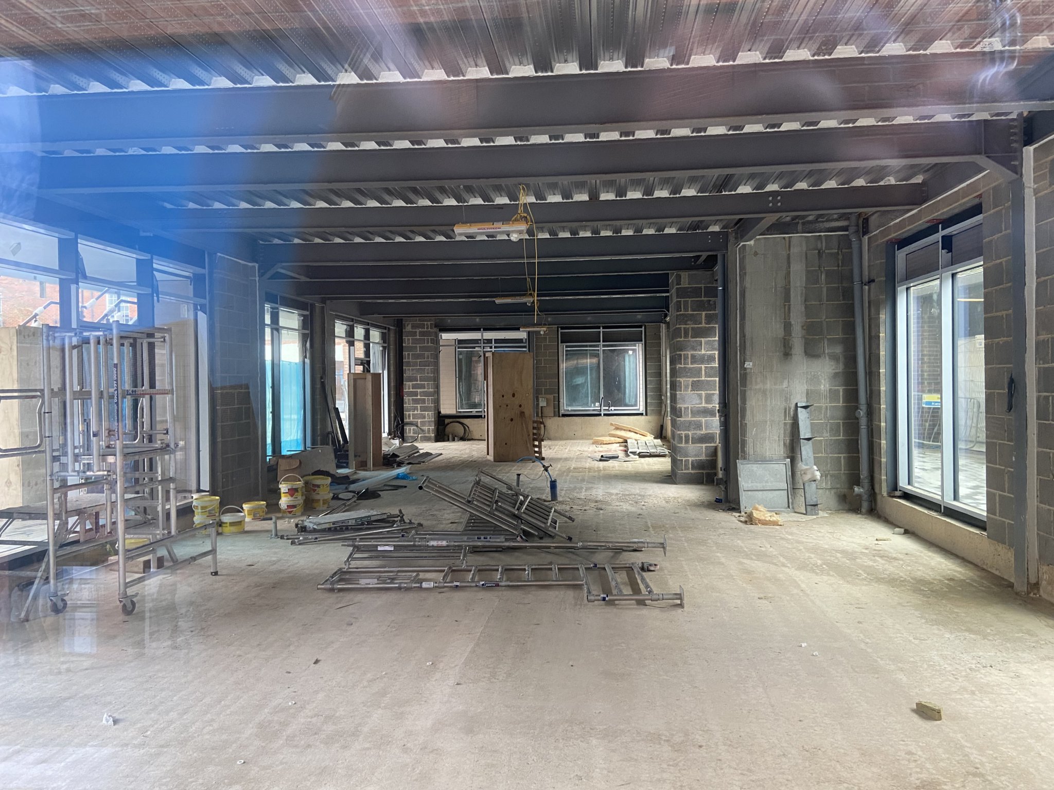 Inside the glass-fronted D21 building overlooking the new town square