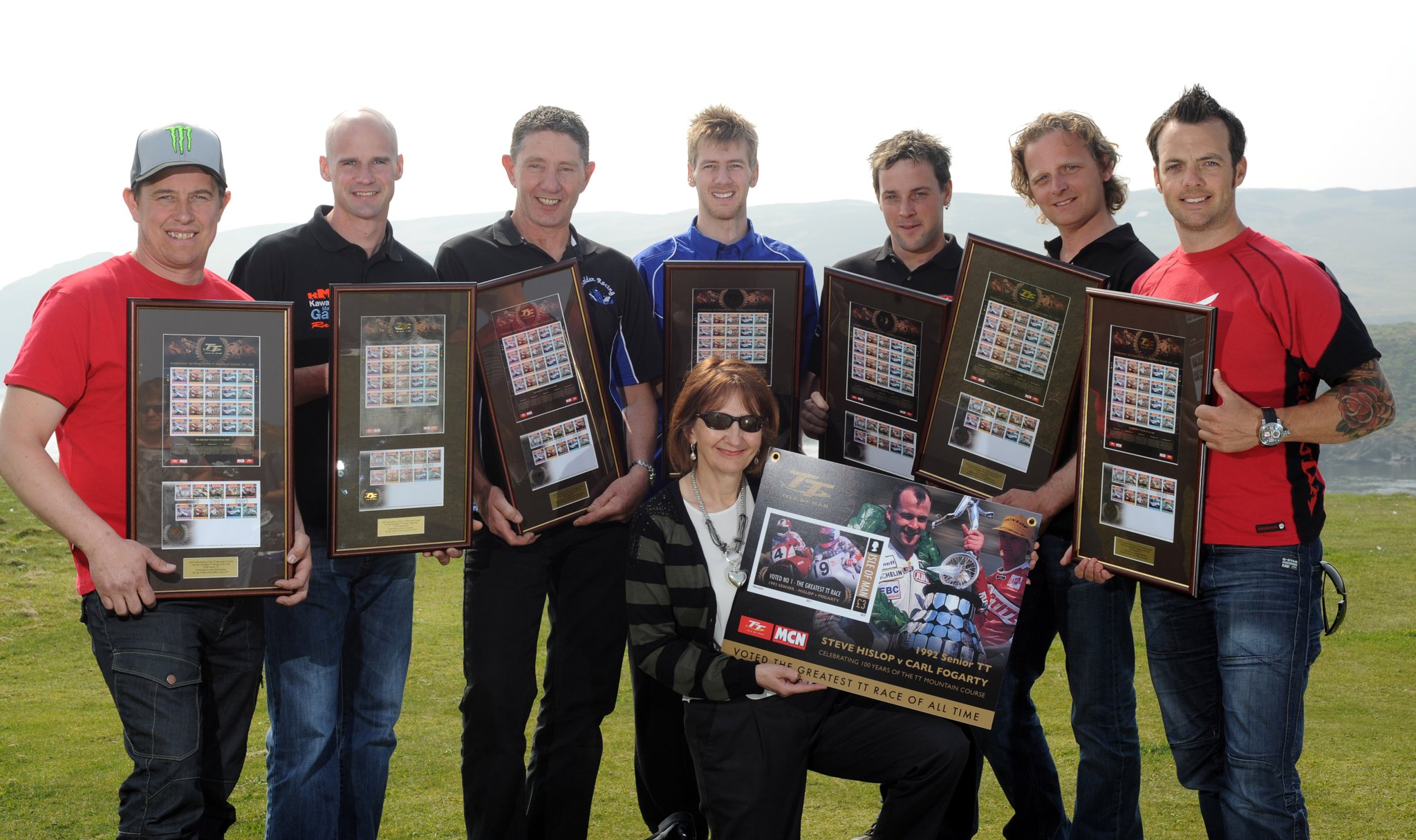 Launch of TT 2011 stamps: Back row from left: John McGuiness, Ryan Farquhar, John Holden, Ian Hutchinson, Dan Sayle, Klaus Klaffenbock, Cameron Donald.
Front row centre: Dot Tilbury, General Manager Philatelic Bureau of Isle of Man Post Office