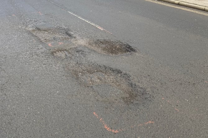 Surrey County Council says highways engineers are aware of the worsening condition of the road in South Street, Farnham