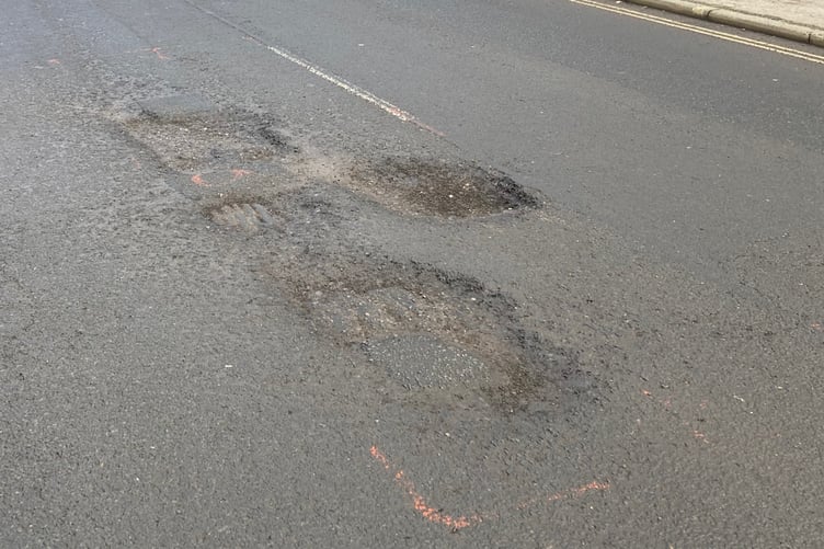 Surrey County Council says highways engineers are aware of the worsening condition of the road in South Street, Farnham