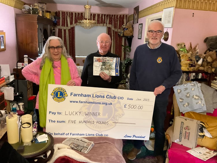 This lucky couple scooped the £500 star prize – but only after finding their missing Lions' Charity Advent Calendar down the back of their sofa!