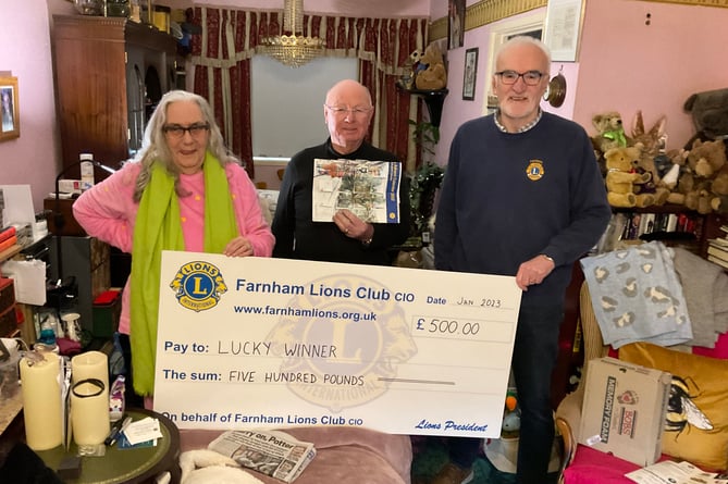 This lucky couple scooped the £500 star prize – but only after finding their missing Lions' Charity Advent Calendar down the back of their sofa!