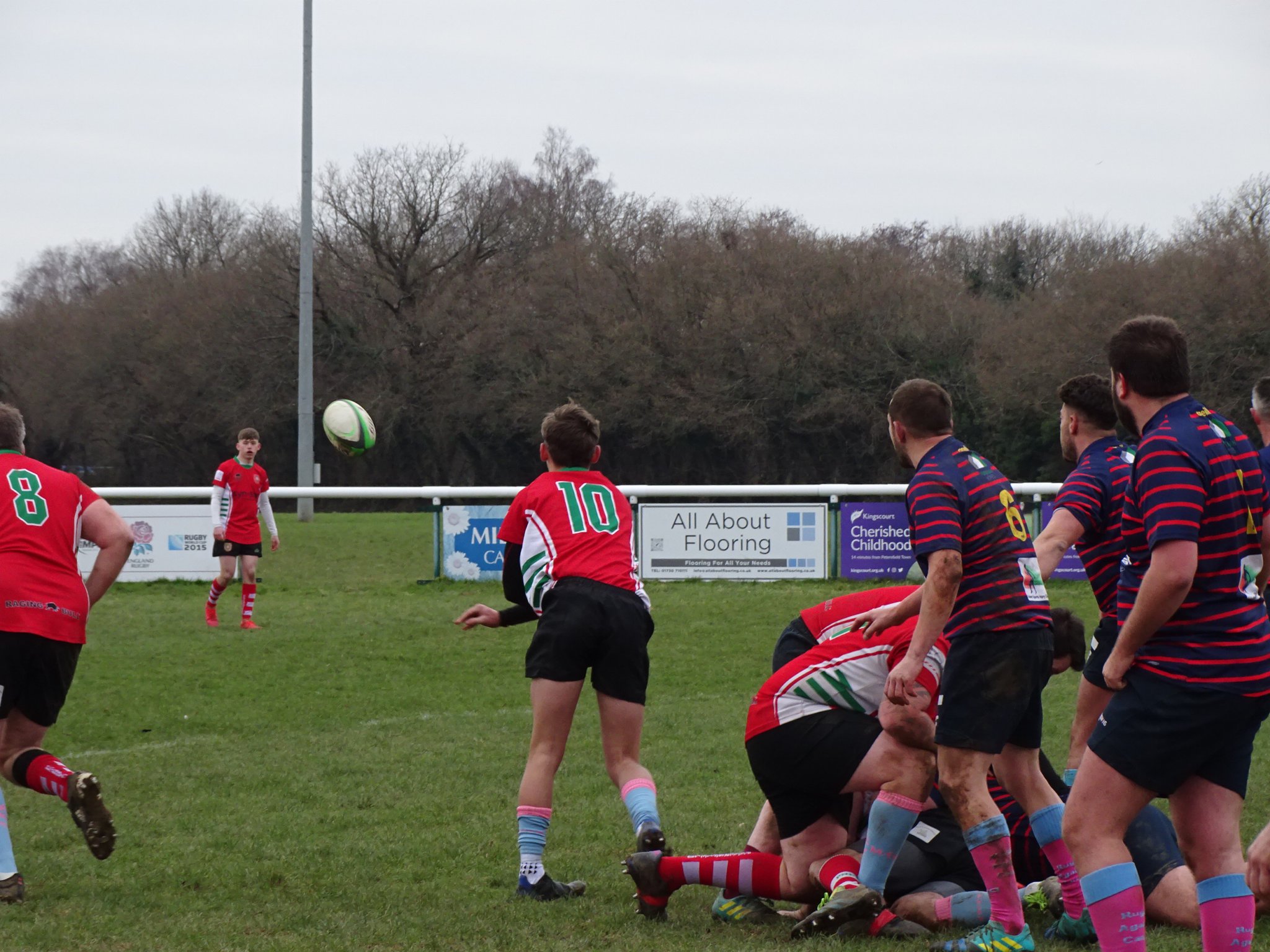 Archie Whitear launches a long pass to Alex Evans