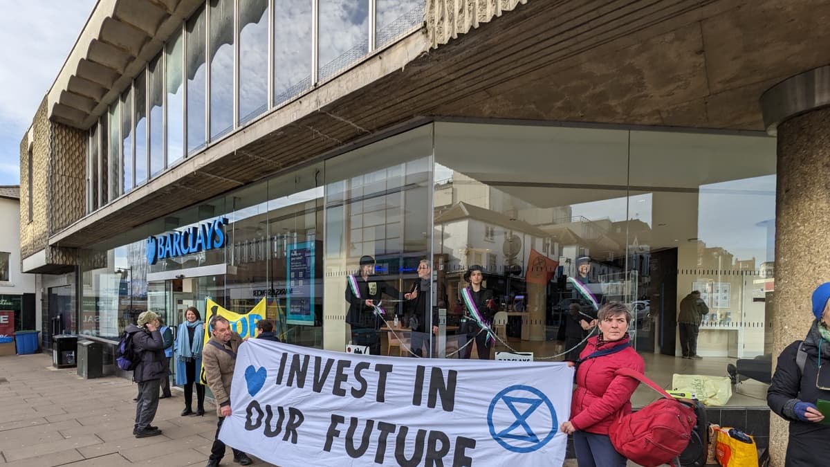 Extinction Rebellion ‘suffragettes’ chain themselves in Barclays