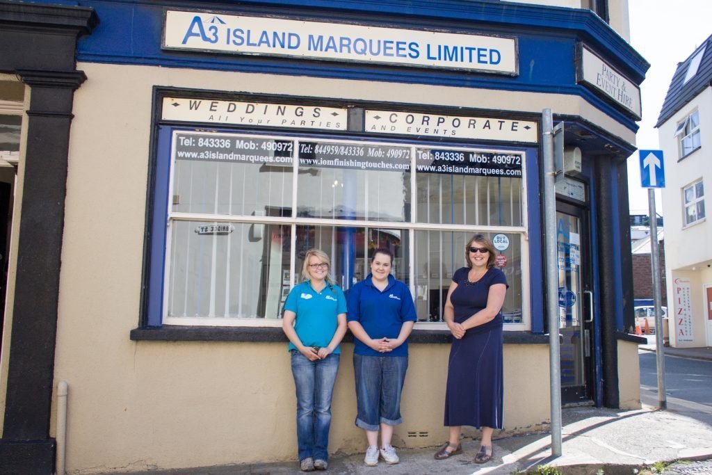 Aalish Bennett, Sophie Gelling and owner Candy Atcheson in front of Island Marquees Limited at Atholl Place, Peel Photo: Chris Littler