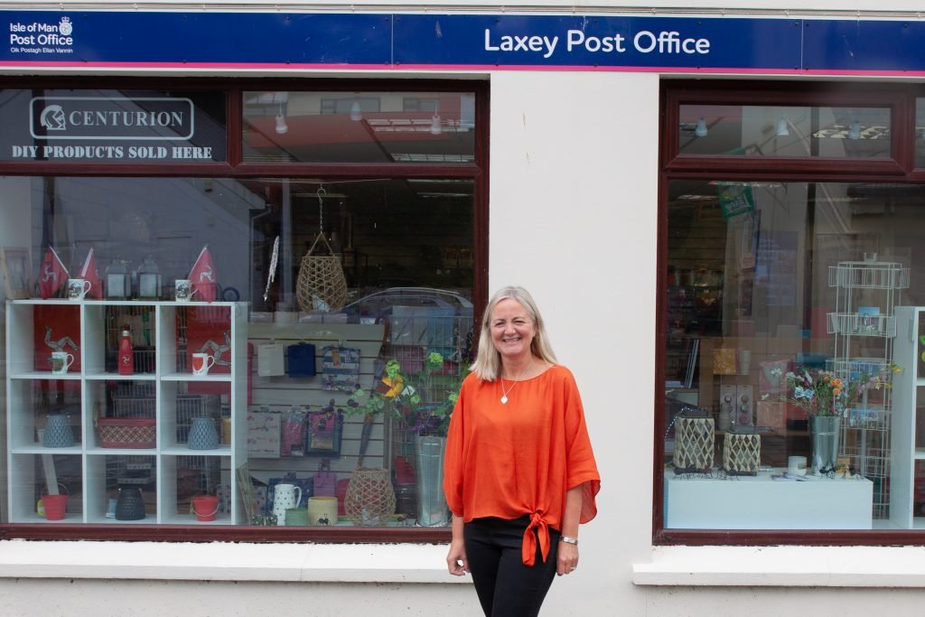 Post mistress Mary Palmer in front of the Laxey Post Office at 19 New Road, Laxey in 2022 Photo: Chris Littler