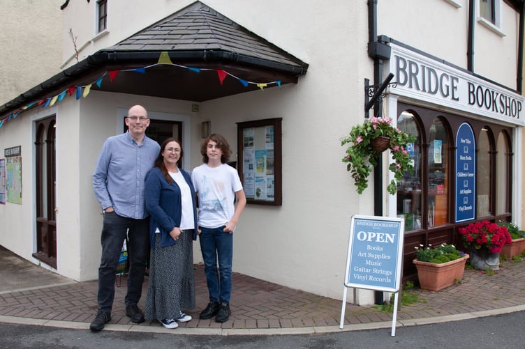 Harry, Angela and Ben Pickard in front of Bridge Bookshop in Port Erin in 2022 Photo: Chris Littler
