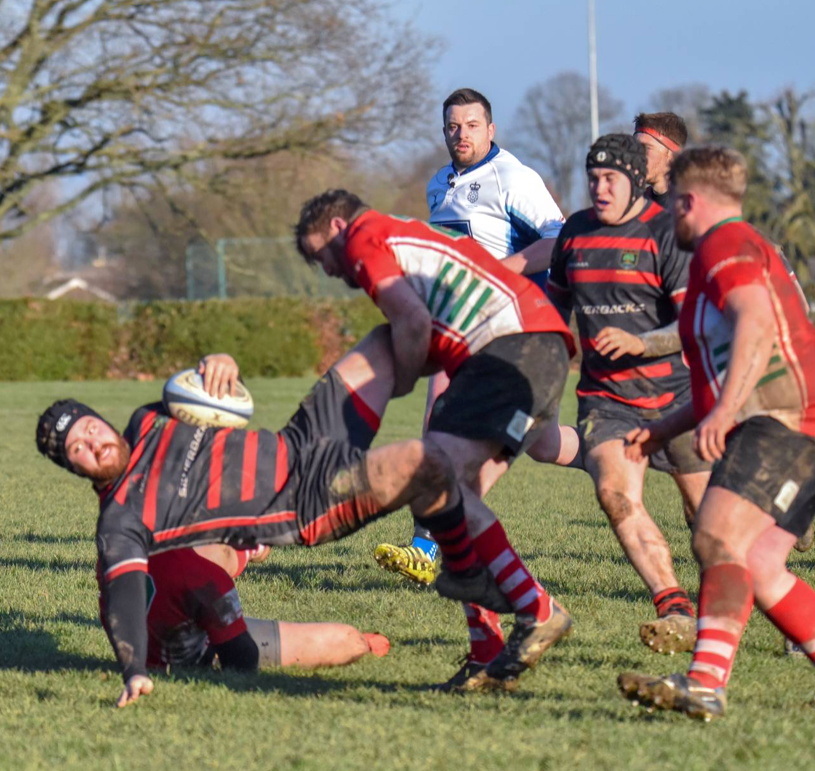 Crash landing... Oli Fielder is upended in midfield