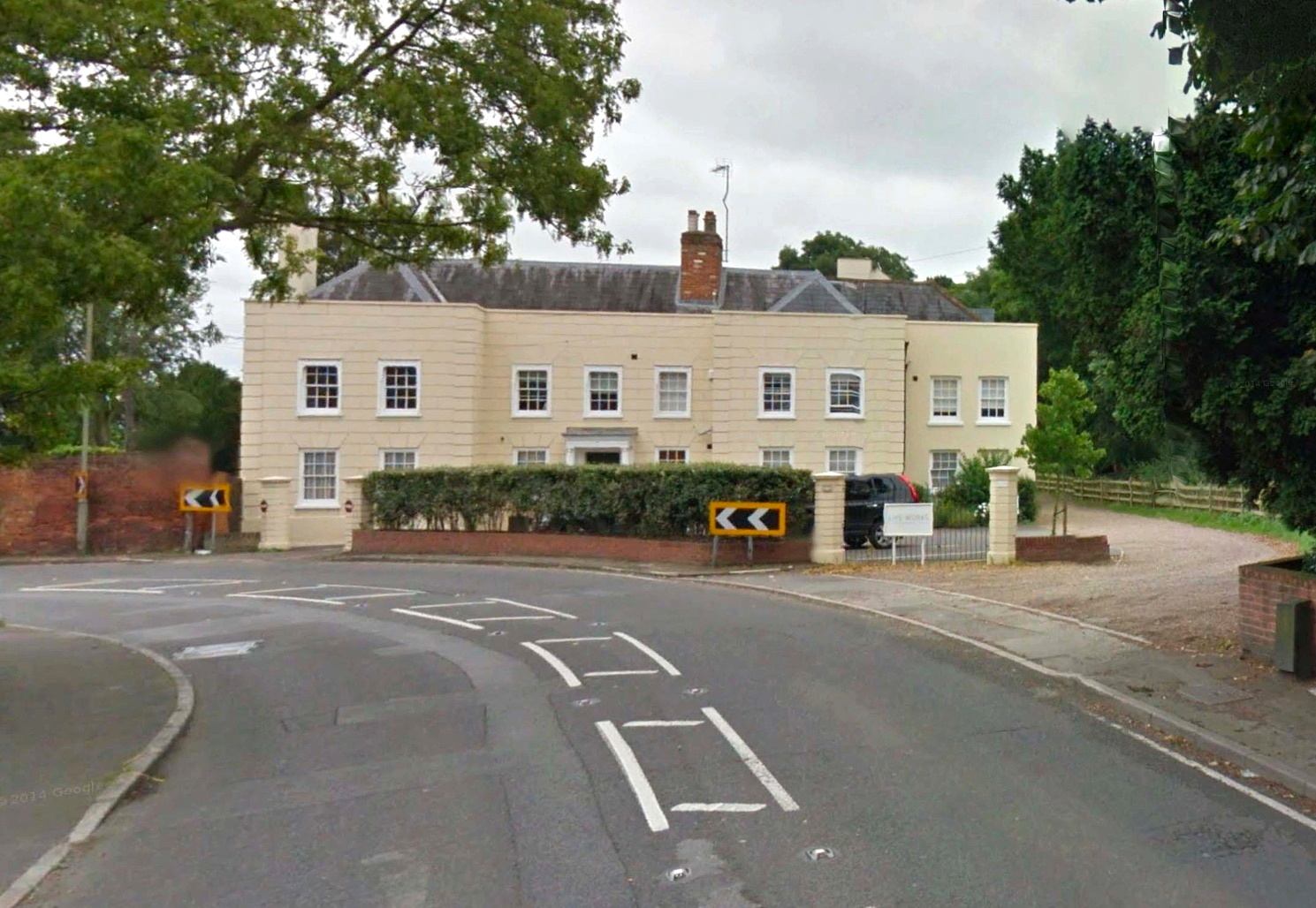 The Wilson family lived at The Grange, above as it is today, in Old Woking.