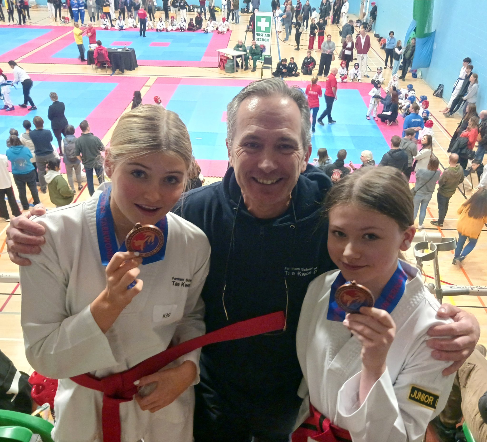 Lulu Oram-Tooley and Tyla Nawrattel with their coach