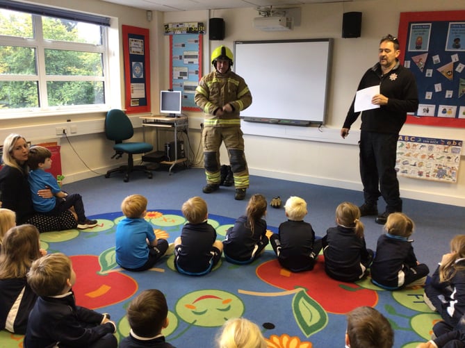 Children at St Ives school with Surrey Fire and Rescue Service staff