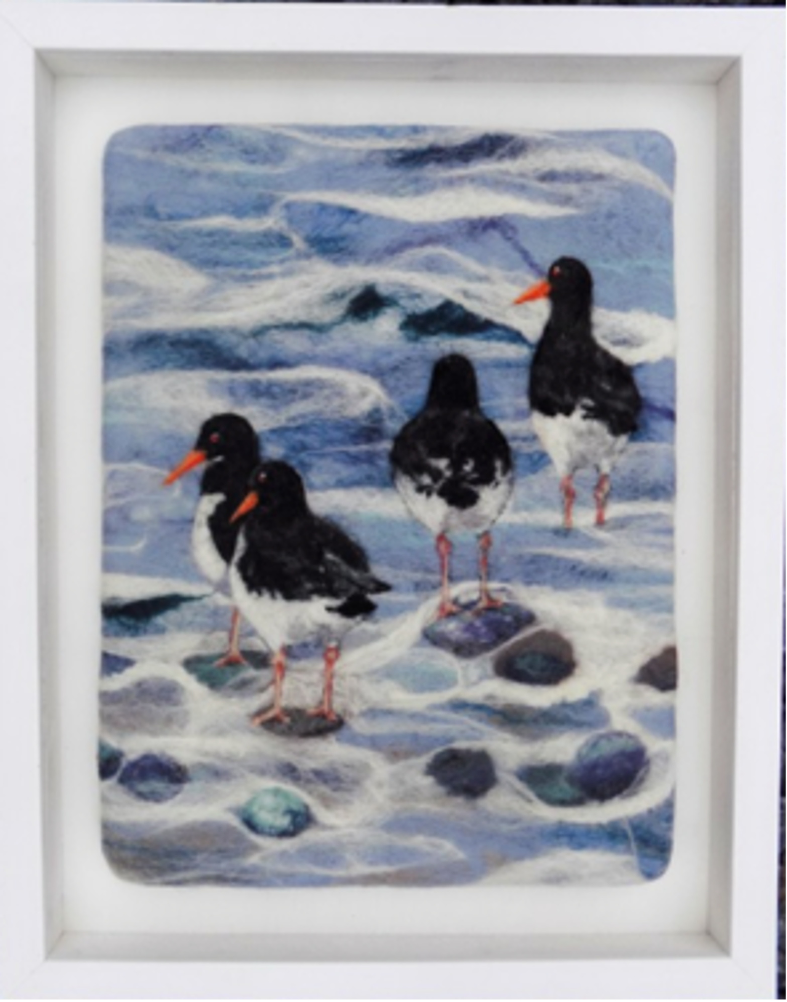 A felted wool picture by Sue Powell of ‘Oystercatchers in the Waves’