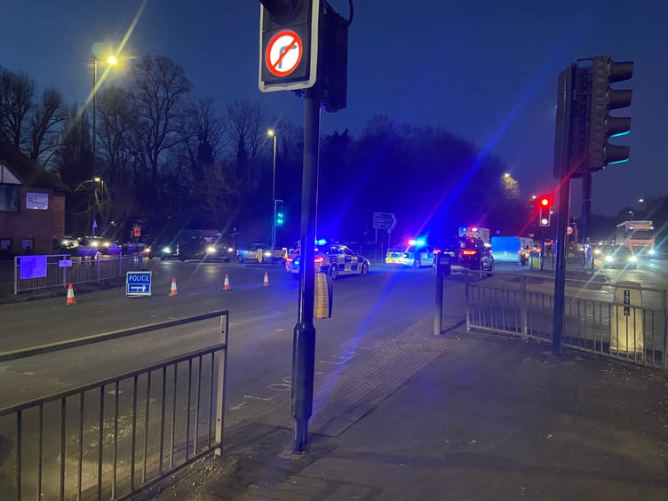 One police car, an ambulance and a critical care paramedic attended the incident at the A31 Hickleys Corner junction on Monday. A dark car could also be seen pulled up just beyond the junction close to the Brightwells Yard construction entrance.