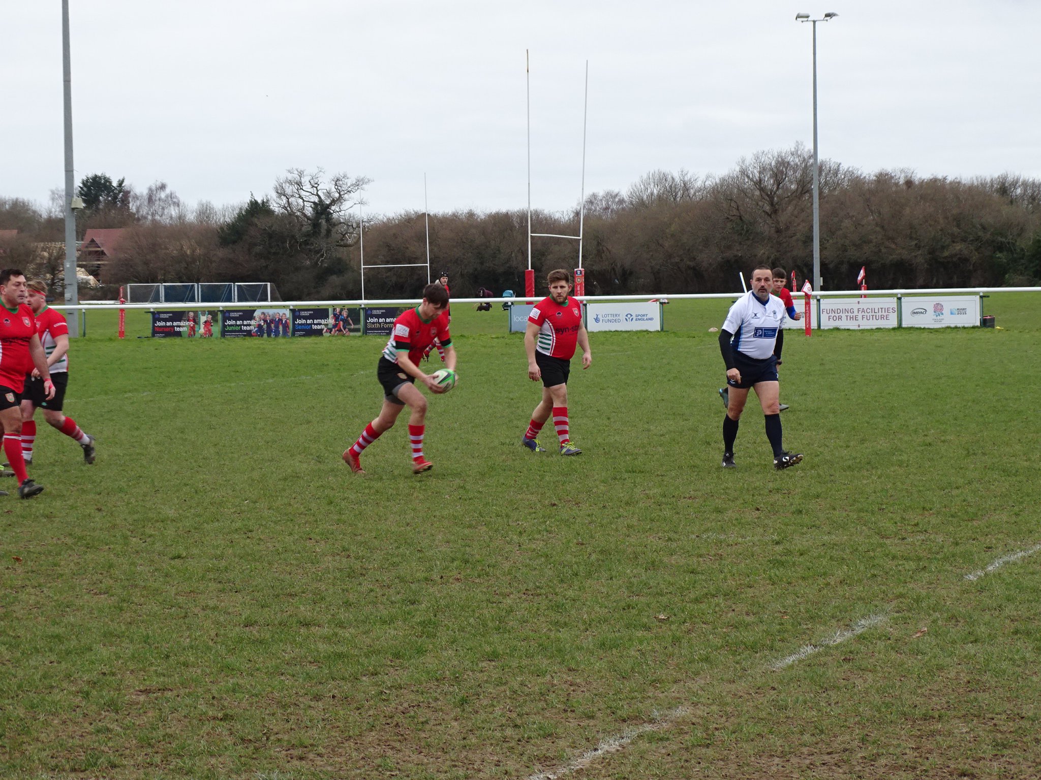 Fin Sloan takes the free kick with captain Sam Brown watching on