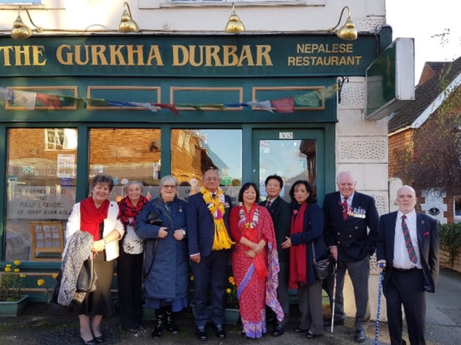 Mani and Sudha with staff and just some of The Gurkha Durbar’s many loyal customers outside the restaurant