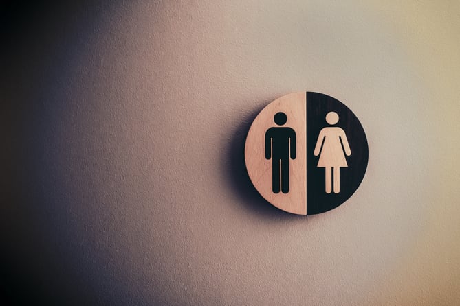 Male female toilet sign for article on gender