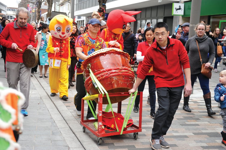 The lion dancers performed to the beat of a traditional drum and gongs.
