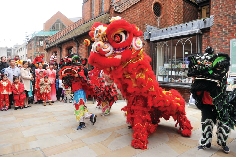 Lion dancers thrilling spectators during their performance.