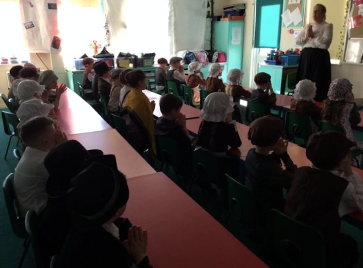 Children tried their hand at writing on chalkboards as part of the time travelling experience