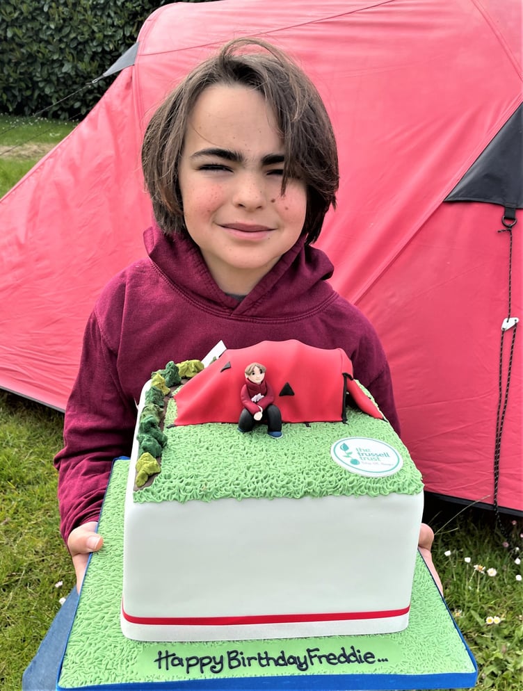 Marking his 11th birthday with a suitably decorated cake.