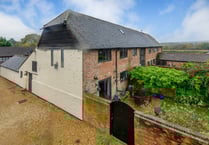 Former barn for sale is "unique" home with stained glass windows